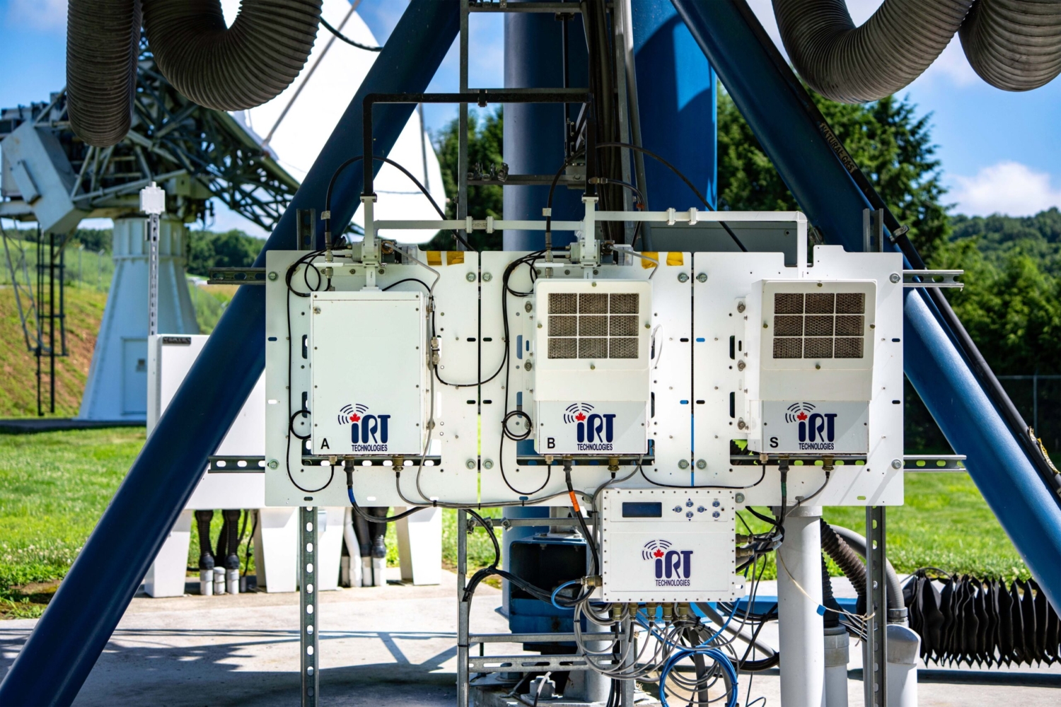 Outdoor RF amplifiers installed on satellite antenna infrastructure.